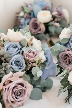 the bridal bouquets are laid out on the table