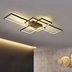 a modern ceiling light with dim lighting in a living room or dining room, on the wall