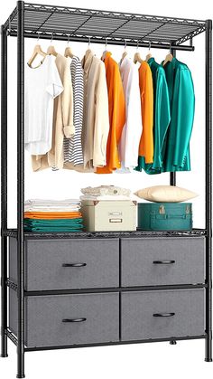 an organized closet with clothes hanging on the rack and two drawers below it, along with other items