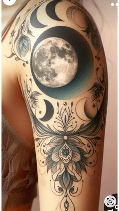 the back of a woman's arm with tattoos on it and a full moon in the background