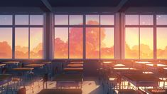 an empty classroom with desks and chairs in front of large windows that look out onto the sky