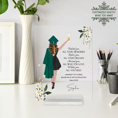 a graduation card with an image of a woman in a green cap and gown holding a star