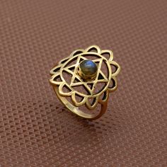 Labradorite Shri yantra Ring, Labradorite Jewelry, Brass Ring, Gemstone Ring, Engagement Ring, Statement Ring, Birthstone Ring Gift For Her IMPORTANT NOTE....👇 free surprise gift on purchase of 1 product. 2 rings free gifts on purchase of 5 products. ❥ Customers' satisfaction is our biggest priority, please contact us with any questions/queries for future or existing orders, and we will do our best to make sure you are happy with your order. ❥Please make sure to add the correct address during checkout. You can return your purchased item within 15 days after successful delivery. We offer a 100% "Money Back Guarantee" if you are not satisfied with your purchase. Return charges will be paid by buyers only! My Store Link 👇 https://www.etsy.com/shop/Trinkefy?ref=seller-platform-mcnav Thank Yo Shri Yantra, Chakra Symbols, Labradorite Jewelry, Yoga Jewelry, Brass Ring, Labradorite Ring, Heart Chakra, Surprise Gifts, Birthstone Ring