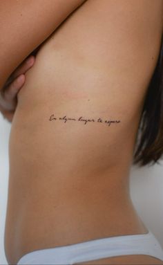 the back of a woman's stomach with an inscription on it that says, be your