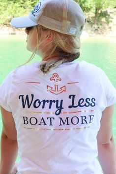 a woman wearing a white shirt with the words worry less boat more on it