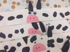 the paper cow is cut out to look like it's making a funny face