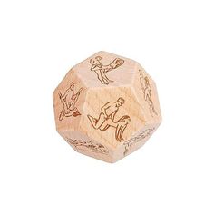 a wooden dice with drawings on it