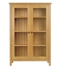 an oak bookcase with glass doors on the front and bottom shelves, against a white background