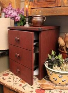 an old dresser has been converted into a kitchen cover