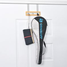 a black bag hanging from the side of a white door