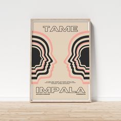 a poster with the words tame on it in front of a white wall and wooden floor