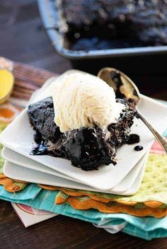 a plate topped with ice cream next to a bowl of jelly and blueberry compote