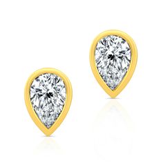 Experience timeless elegance with our Pear Shape Diamond Bezel Studs, crafted from luxurious 18k yellow gold. These exquisite earrings feature dazzling pear-cut diamonds with a 0.390 total carat weight. These studs are delicately encased in sleek bezel settings. Perfect for both everyday wear and special occasions. Luxury Pear Shaped Yellow Gold Diamond Earrings, Luxury Pear-shaped Jewelry With Bezel Setting, Pear Cut Diamond, Heart Shaped Diamond, Pear Shaped Diamond, Bezel Diamond, Pear Cut, Pear Shape, Bezel Setting