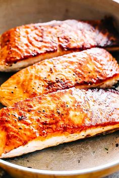 two salmon fillets in a frying pan ready to be grilled or cooked