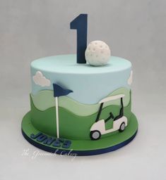 a birthday cake for a one year old boy with a golf theme on the top