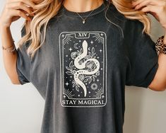 Add some mystical style to your wardrobe with our Tarot Card Shirt! Whether you're a believer, hobbyist, or collector of all things mystical, you gonna love this Comfort Colors Tee! 🧡 Comfort Colors Unisex Shirt  🚚 Fast Shipping 👇🏼 Sizing & Shipping info below  👕 Printed using Direct To Garment style  SIZING  There is a sizing chart included in the images. This shirt fits like a normal unisex shirt so if you order your normal women's size, then it will be a nice relaxed fit. If you want an Tarot Cards Shirt, Mystical Style, Celestial Style, Tarot Card Shirt, Comfort Colors Tee, Mode Inspiration, Tarot Card, Top Casual, Vintage Tees