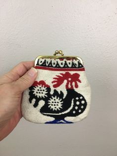 Retrocorrect vintage womens accessory 1950s/1960s Handmade Coin Wallet *Rooster *Thick Cotton *Embroidered Cotton *White, Red, Black, Blue *Kissing Snap Lock *Cotton Lining *Vintage Souvenir Measurements 4 1/2" bottom width  5" height Materials - Thick Cotton Condition - Excellent True Vintage Thank Youfor being 'retrocorrect' *Reminder Note Please keep in mind, all of my items are 100% authentic vintage. This means they are not new and may show natural signs of wear and age. I do my very best to make note of any and all flaws in the item description but there may be something tiny that we overlook. Please read Shop Policies and Shipping Conditions. ALL SALES ARE FINAL *Please ask all questions before making a purchase *Please compare measurements to yours ensuring a perfect fit *Please re Retro Pouch Coin Purse, Retro Handmade Pouch Coin Purse, Retro Coin Purse For Daily Use, Handmade Retro Pouch Coin Purse, Handmade Vintage Compact Coin Purse, Handmade Compact Vintage Coin Purse, Retro Handmade Coin Purse For Daily Use, Retro Coin Purse Gift, Vintage Coin Purse For Daily Use