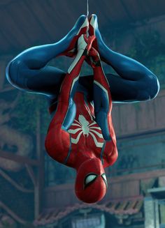 the amazing spider - man is hanging upside down