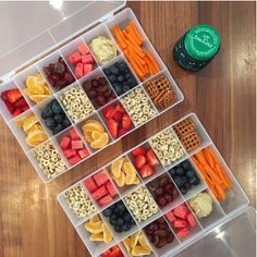 two plastic containers filled with fruit and crackers