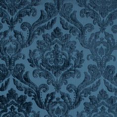 a blue wallpaper with an ornate design on it