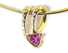 A gorgeous genuine pink sapphire trillion cut is accented with diamonds in this slide pendant of 14k solid yellow gold. Sapphire is September's birthstone and the 5th and 45th wedding anniversary gemstone. Diamond is the birthstone for April and the 10th and 60th wedding anniversary gemstone. The natural pink sapphire is from Madagascar and is a 8 mm trillion cut and weighs 1.45 carats The nine diamonds are round brilliant cut and have a total weight of .20 carats G-H color VS2 Clarity Measures: 60th Wedding Anniversary, 45th Wedding Anniversary, 60 Wedding Anniversary, 21 Grams, Deep Red Color, September Birthstone, Yellow Gold Pendants, Yellow Sapphire, Chain Pendant