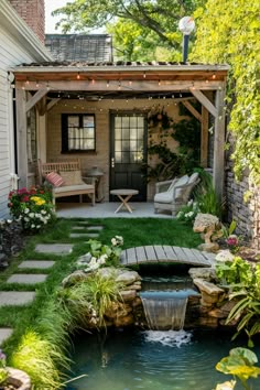 Cozy backyard patio with string lights, wooden furniture, and a small pond with a waterfall. House With Small Garden, Small Backyard Decor Ideas, Small Backyard Decorating Ideas, Small Backyard Decor, Small Backyard Garden Ideas, Backyard Hideaway, Small Backyard Oasis, Backyard Decorating Ideas, Backyard Decor Ideas