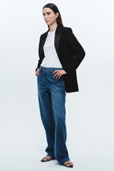 Experience a new level of comfort and style with our cotton-tencel blend flat front pants. We've taken denim to the next level by infusing it with tencel, a fabric renowned for its exceptional softness and breathability. The fabric's softness is unmatched - similar to sweats but with an elevated trouser-like silhouette. What sets these pants apart is their thoughtful design. Instead of the traditional five-pocket jean style, we've added unique pant details that exude sophistication and elevate y Elegant Relaxed Fit Jeans With Pockets, High Rise Relaxed Fit Tencel Jeans, Relaxed Fit High Rise Tencel Jeans, Straight Leg Tencel Jeans With Pockets, Classic Full Length Jeans For Work, Elegant Straight Leg Jeans With Pockets, Medium Wash Wide Leg Tencel Jeans, Relaxed Fit Denim Pants For Business Casual, Elegant Dark Wash Pants For Workwear