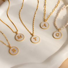 P E A R L ∙ C O I N ∙ I N I T I A L ∙ N E C K L A C E Our Pearl Coin Initial Necklace features a lustrous Mother of Pearl pendant with your initial encrusted in a delicate pavé setting. The perfect blend of elegance and shimmer, this necklace offers a timeless charm that beautifully complements any outfit. Personalize it and select your chain style to create a look that's uniquely yours ♡  * Material: High Quality Solid 925 Sterling Silver  * Finish: 18K Gold ∙ Sterling Silver ∙ Rose Gold  * Fea Custom Chain, Initial Disc Necklace, Pearl Jewelry Gift, Initial Gifts, Letter Pendant Necklace, Initial Pendant Necklace, Disc Necklace, Custom Initials, Initial Pendant