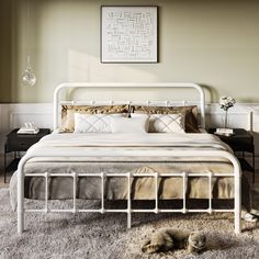 a white bed sitting on top of a shaggy rug