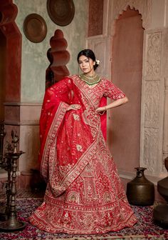 Item: Lehenga Set ( Lehenga Skirt, Blouse and Dupatta) Enter opulence with our captivating Crimson Charm bridal lehenga, meticulously tailored to make a statement. Every detail of this bridal attire exudes sophistication and allure with its intricate embellishments. The hand-embroidered zardozi work with cutdana and sequins adds a touch of artisanal magic, while the blouse and dupatta elegantly complement the lehenga beautifully. A lehenga as unique as you, every aspect of this lehenga reflects our commitment to excellence. Crafted with utmost care by our artisans, this ensemble exudes sophistication and charm. From the intricate zari detailing to the contemporary raw silk fabric, every element is designed to make you feel like royalty on your wedding day Our bespoke lehengas are designed Zardozi Work, Special Occasion Gowns, Bridal Attire, Raw Silk Fabric, Skirt Blouse, Lehenga Skirt, Saree Blouses, Bridal Lehenga, Raw Silk