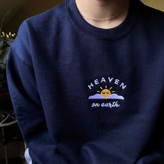 "*SIZES ARE UNISEX* -For women, I'd suggest your usual size for a regular fit (size up for a more relaxed fit). Men should size up for a more relaxed fit. *these sweatshirts are extra comfy when oversized 🌤 \"Heaven on Earth\" embroidery on a comfy cute crewneck. A sturdy and warm navy sweatshirt bound to keep you warm in the colder months. A pre-shrunk, classic fit sweater that's made with air-jet spun yarn for a soft feel and reduced pilling. Your new favorite sweatshirt! * 50% cotton, 50% po Earth Embroidery, Sweater Embroidery, Sweatshirt Ideas, You're So Golden, Cute Crewneck, Navy Sweatshirt, Embroidery Sweater, Hand Embroidery Projects, Christian Sweatshirt