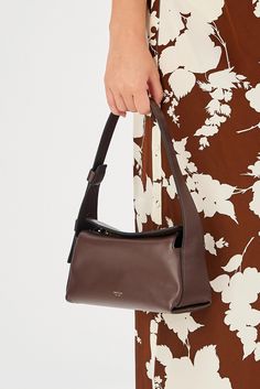 [vc_row][vc_column width=”1/3″][vc_column_text text_larger=”no”] Oroton Women’s Caroline Small Day Bag   Oroton Caroline Small Day Bag The Oroton Caroline Small Day Bag in bear brown is a stylish and versatile accessory with a top flap featuring hidden magnetic and zip closures for convenience and security. Made from smooth leather with a foil embossed logo, it exudes sophistication. The 100% cotton twill lining adds a touch of luxury. The bag has a single spac Everyday Brown Bag With Handle Drop, Elegant Everyday Brown Bag, Elegant Brown Everyday Shoulder Bag, Elegant Everyday Pouch Shoulder Bag, Elegant Everyday Shoulder Bag With Dust Bag, Oroton Bag, Design Your Own Shoes, Bear Brown, Profile View