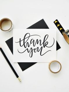 a thank you card surrounded by washi tape and other items