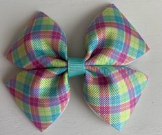 "Reilly Rainbow Designs creates handmade hair bows, to help your child always feel confident and fashionable at the same time. This beautiful bow is created with Grosgrain ribbon and either an alligator hair clip or a nylon headband.  These bows measure approximately 3.5\". Each bow is packaged on a bow card and shipped in a bubble envelop to protect each item during transit. All orders ship within 1-2 business days of purchase via USPS. Please note, this is NOT transit time, as I am not respons Alligator Hair Clip, Pastel Plaid, Rainbow Pastel, Handmade Hair Bows, Rainbow Design, Nylon Headbands, Barrette Clip, Pastel Rainbow, Hair Accessories Headbands