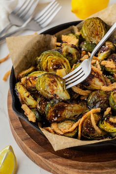 a skillet filled with cooked brussel sprouts and fried onion rings