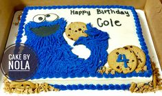 a birthday cake with cookie cookies and an image of cookie monster on it in a box