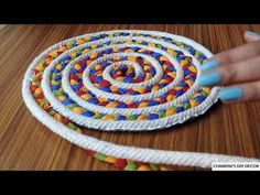 someone is making a colorful rope art project