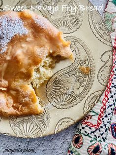 a piece of pie on a plate with powdered sugar over it and the words sweet potato pie bread