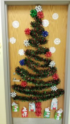 a christmas tree made out of tinsel wrapped presents