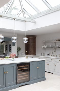 a kitchen with an oven, sink and counter top in the middle of it's center island