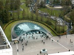 an aerial view of people walking around in the park