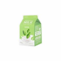 a carton of milk with green leaves on the top and white liquid in it