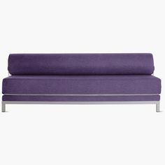 a purple couch sitting on top of a metal frame