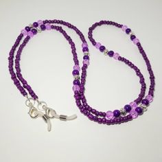 Keep your glasses or your mask close by with this Pretty Beaded Chain. It is a perfect way to brighten up any outfit.  It measures approx. 32 inches. It is made with shades of purple beads with antique silver beads.  You can choose white rubber eyeglass holders for glasses and sunglasses, silver lobster clasps for holding masks, or both to be able to use either way.  It is made with 49 strand jewelry wire for maximum durability, but the 4mm beads make it a very lightweight lanyard. All of my ite Eyeglasses Chains, Lavender Mask, Beaded Eyeglass Chain, Chain Sunglasses, Teacher Office, Sunglasses Silver, Sunglasses Chain, Sunglasses Strap, Beaded Lanyard