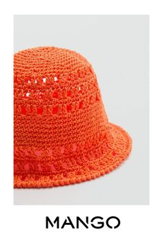 an orange hat with sequins on it and the words mango written in black