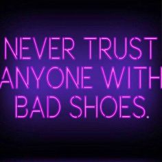 the words never trust anyone with bad shoes are shown in pink neon letters on a black background