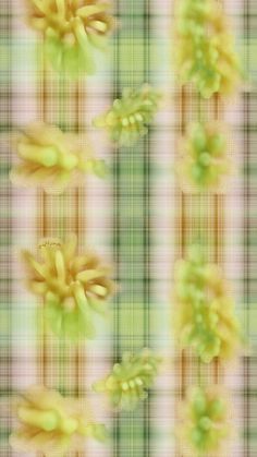 an abstract image of yellow flowers on a green and white checkered background