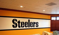 the interior of a restaurant with tables and chairs in front of a sign that reads steeles