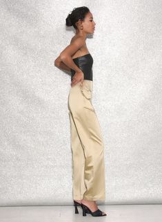 Suit up. Our ultra chic Strapless Tailored Jumpsuit, cut from luxe Italian textured satin with soft vegan leather top. Fitted with boned bodice to flatter your figure. Invisible back zipper closure. Layer over your favorite Essentials panty and be the life of every party. 53% Cotton & 47% AC Vegan Leather: 100% PU Dry clean only; cool iron back side if needed Model is 5'9 and is wearing a size 2. Tailored Jumpsuit, Boned Bodice, Convertible Bra, Rose Lace, Suit Up, Triangle Bra, Demi Bra, Lace Cami, Lace Bodysuit