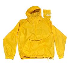 This vintage Woolrich windbreaker is a must-have for any 90s-themed outfit. The bright yellow color and packable design make it perfect for any occasion. Made with durable nylon material, this jacket is built to last and can be worn by both men and women in size medium. The jacket features a classic windbreaker style, making it perfect for outdoor activities or casual wear. This item comes with a bag and is a great addition to any vintage clothing collection. Pit to Pit 22" Length 26" Cheap Yellow Outdoor Windbreaker, Yellow Waterproof Nylon Windbreaker, Waterproof Yellow Nylon Windbreaker, Casual Yellow Waterproof Raincoat, Yellow Functional Windbreaker For Outdoor Activities, Functional Yellow Windbreaker For Outdoor Activities, Yellow Waterproof Windbreaker For Spring, Yellow Waterproof Windbreaker For Outdoor Activities, Waterproof Yellow Windbreaker For Outdoor Activities